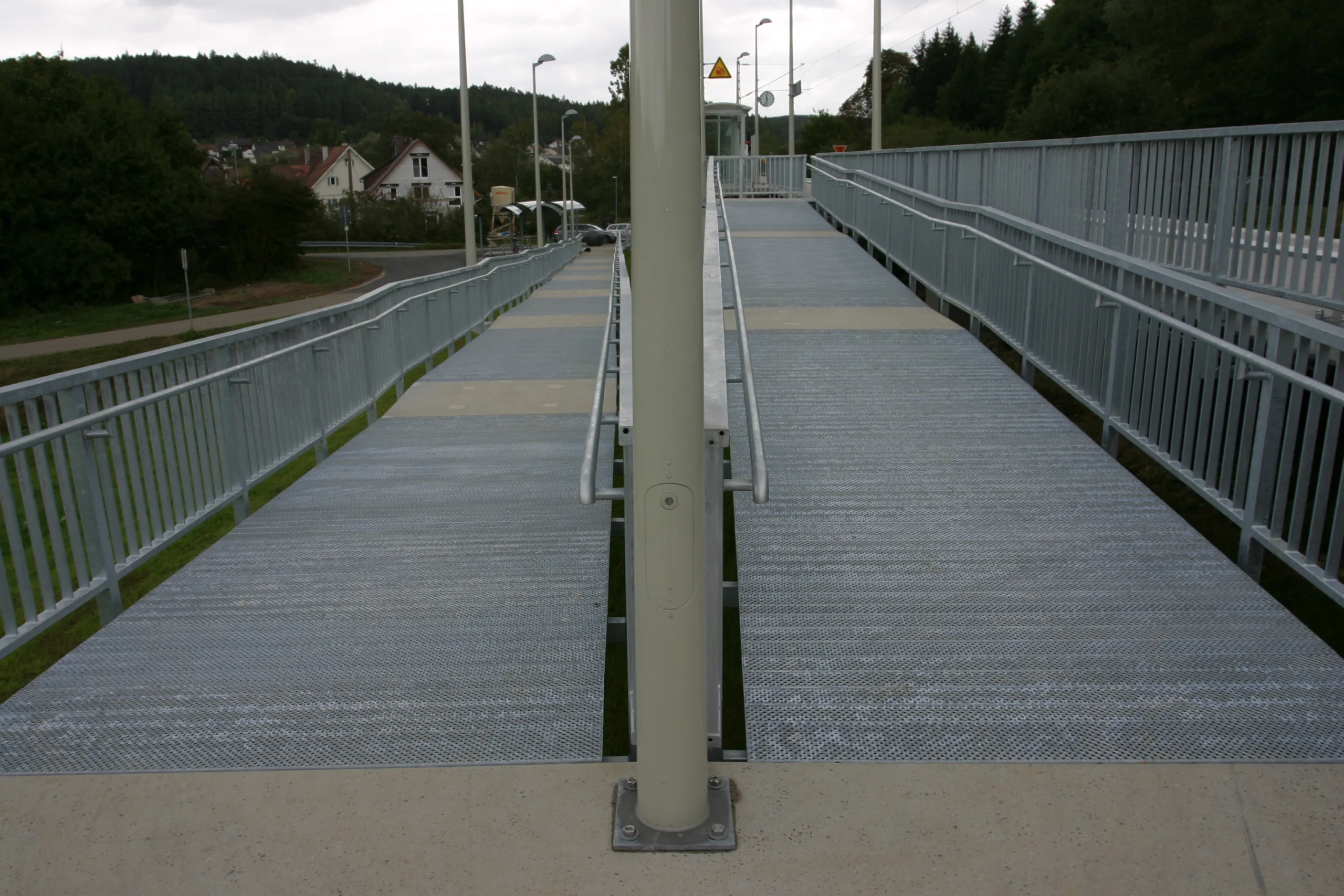 Wheelchair ramp made of safety grating is easy to drive on.  Slip resistance class R13