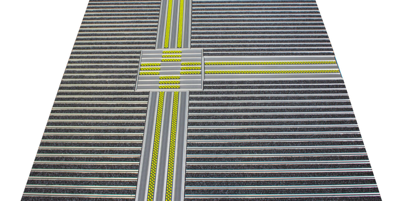 Tapis d'entrée avec système de guidage tactile : accessibilité des bâtiments publics